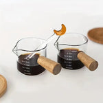 
  
  Double Shot Espresso Glass with Wood Handle - Double Spout for Precise Pouring, Measurement Marks - Perfect for Coffee Lovers & Baristas
  
